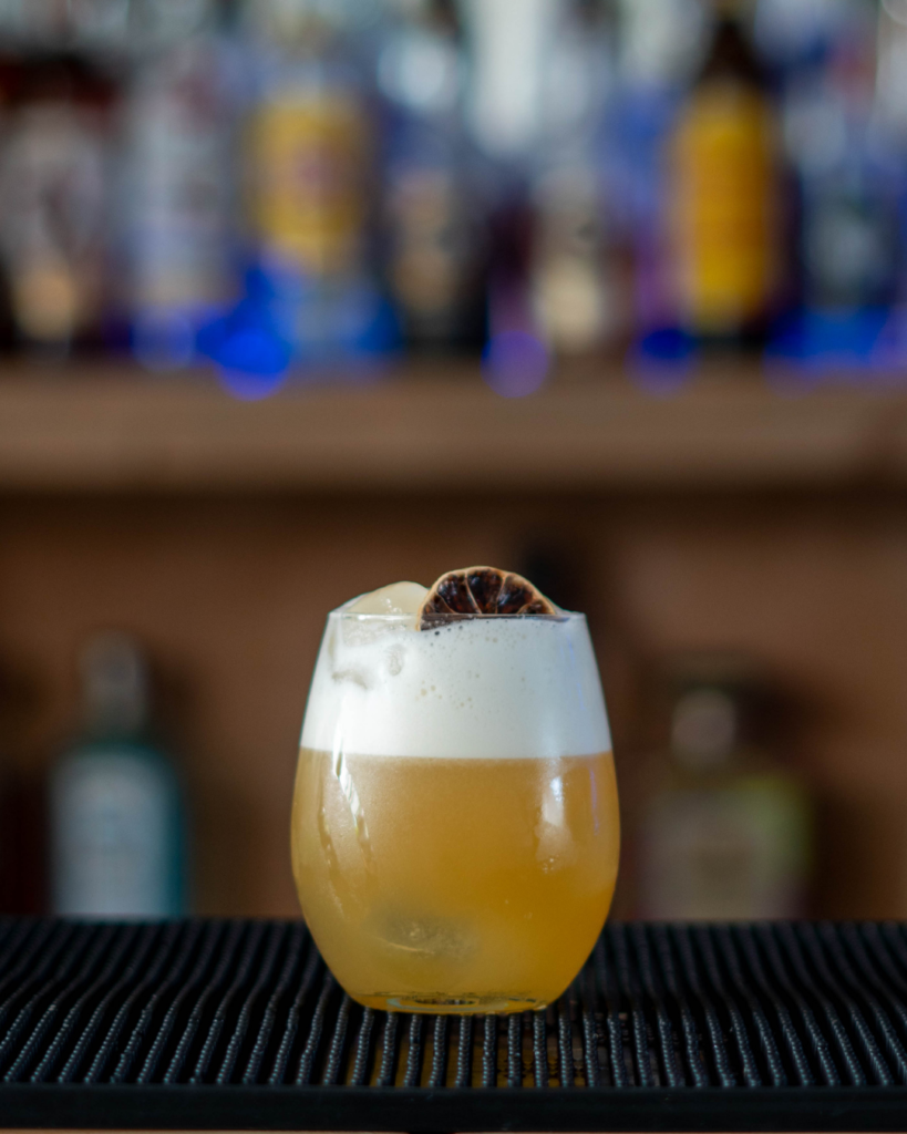 The Amaretto Sour on a bar countertop