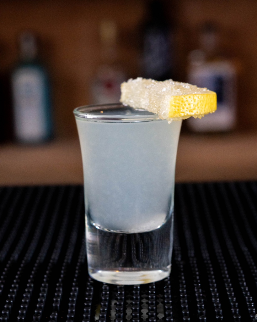 The Lemon Drop Shot on a bar countertop