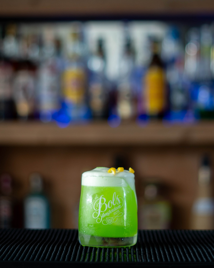 The Melon Sour on a bar top.