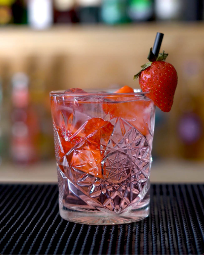 The Pink Gin Rose Lemonade on a bar countertop