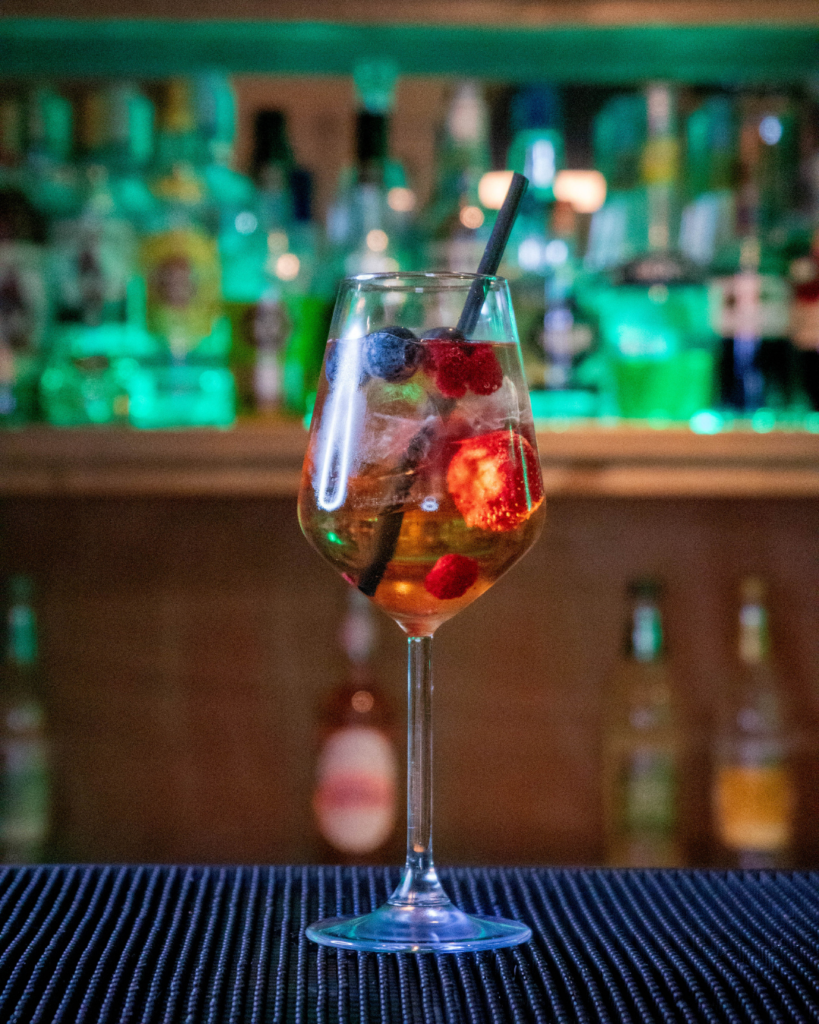 The Wildberry Lillet on a bar top.