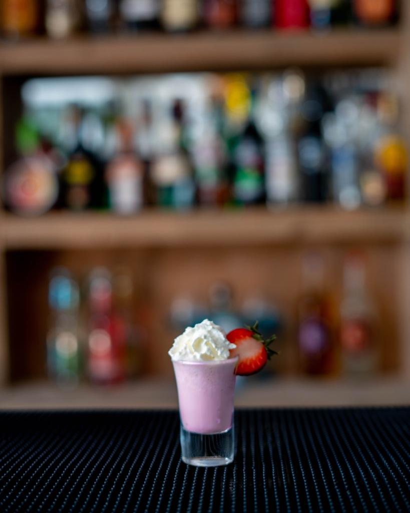 The Strawberry & Cream Shot on a bar countertop