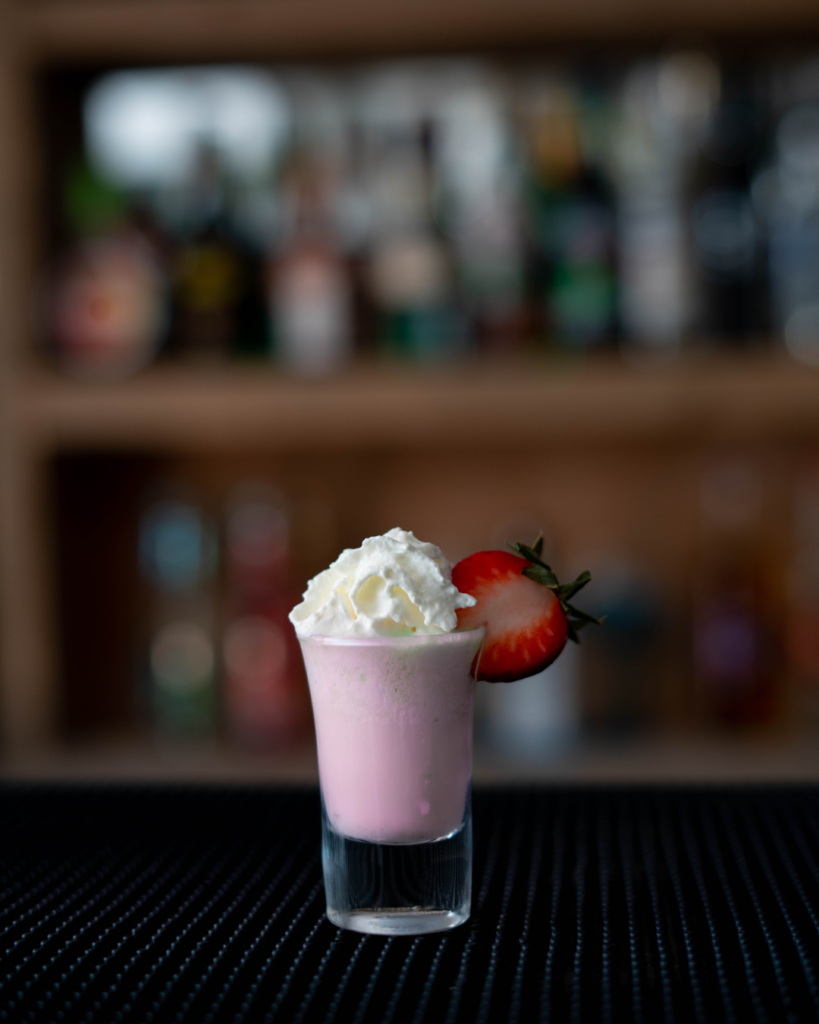 The Strawberry & Cream Shot on a bar countertop