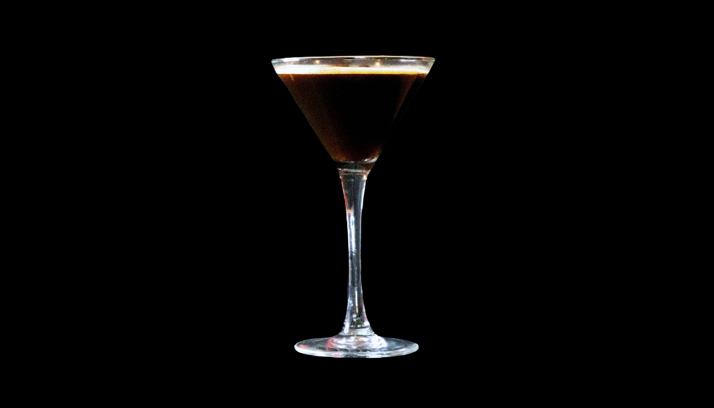 The Espresso Martini on a home bartop with a black background.
