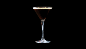 The Espresso Martini on a home bartop with a black background.