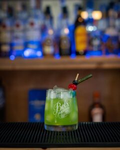 The Hallogreen (Halloween themed drink) cocktail on a home bartop.