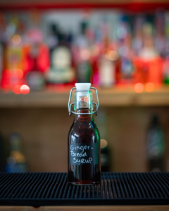 Homemade Gingerbread Syrup on a home bartop.