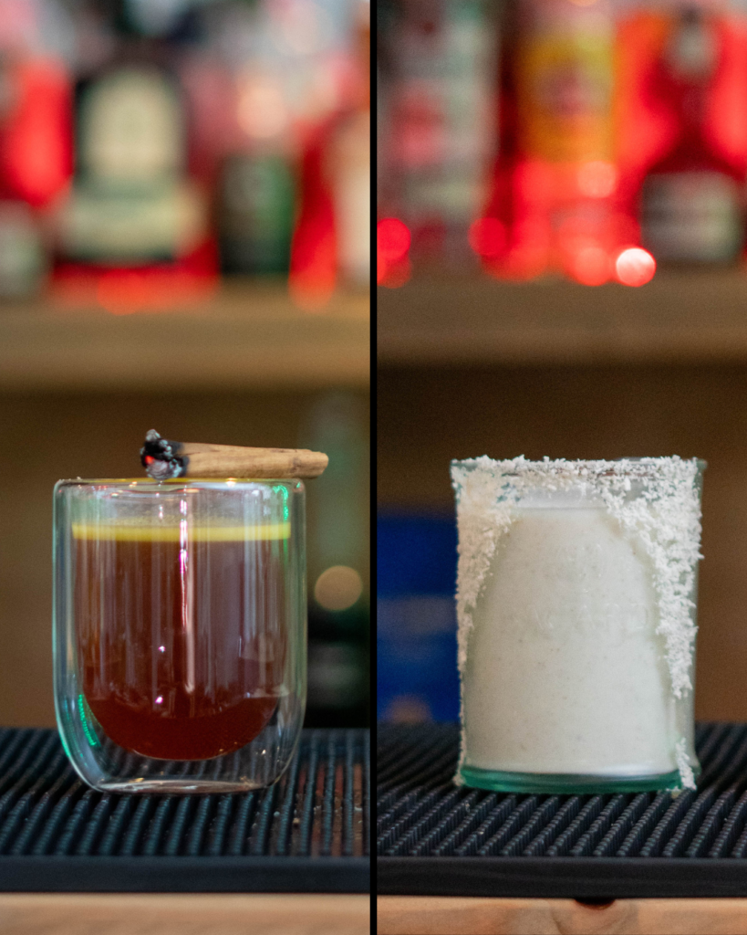 The Hot Buttered Rum & The Coquito, both on a bar top.