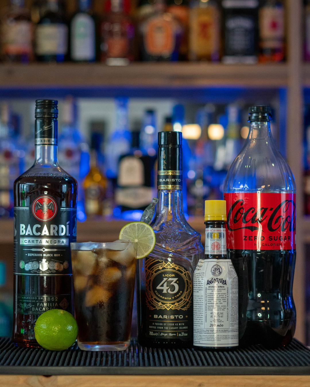 The Baristo By Night on a bar top, surrounded by its ingredients.