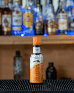 A bottle of Angostura Orange Bitters on a home bar top