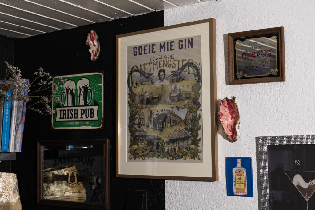Goeie Mie Gin poster, de Leidsche Gifmengster, on a Home Bar wall with other drink inspired posters 
