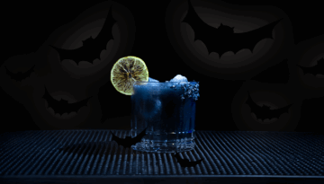 The Black Margarita on a home bartop with an all black background.