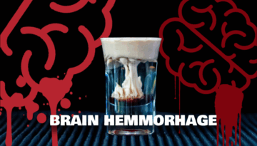 The Brain Hemorrhage Shot on a home bartop with a black background with two brains draining in blood