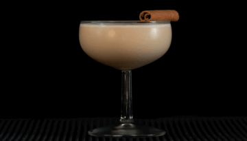 The Cinnamon Roll Martini with a black background