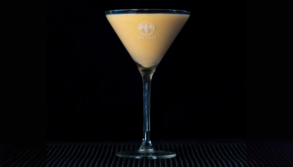 The Pumpkin Pie Martini with a black background.