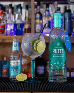 Gin & Tonic: Rutte Kaffir Lime Gin & Fever-tree Mediterranean Tonic mixed on a home bartop.