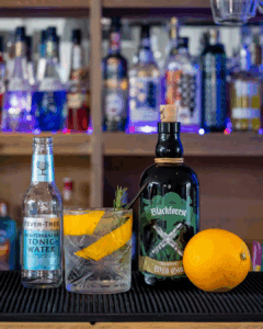 Black Forest Wild Gin & Fever-Tree Mediterranean Tonic Water mixed on a home bartop.