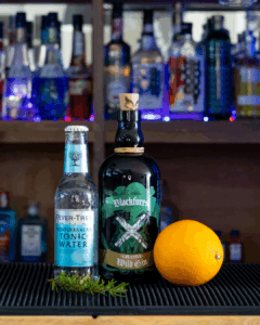 Black Forest Wild Gin & Fever-Tree Mediterranean Tonic Water mixed on a home bartop.