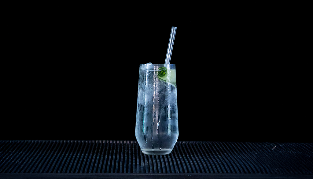 Gin & Tonic: Hendricks Gin & Fever-tree Indian Tonic mixed on a home bartop with a black background.