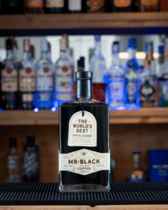 A bottle of Mr. Black coffee liqueur on a home bartop.
