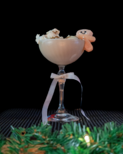 The Baileys Gingerbread Martini on a home bartop with a black background