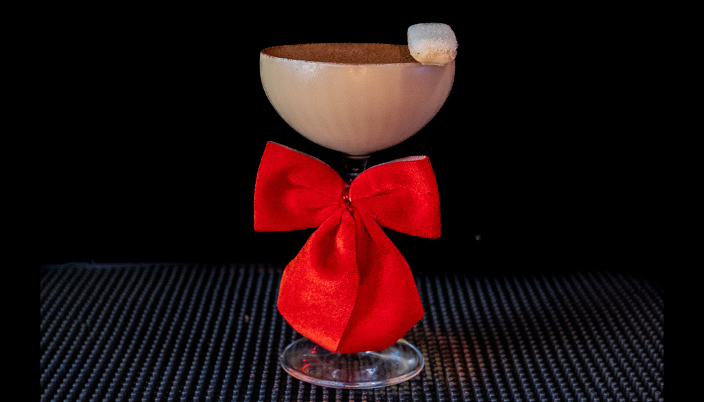The Baileys Tiramisu Martini on a home bartop with a black background