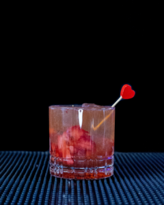 The Kentucky Kiss on a home bar top with an all black background