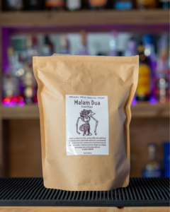 Kopi Dua Malam Dua Coffee beans in a bag on a home bar top