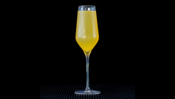 The Mimosa on a home bar top with an all black background