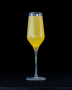 The Mimosa on a home bar top with an all black background