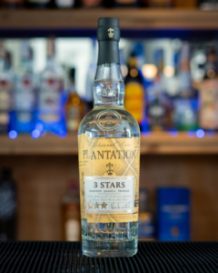A Bottle of Planteray 3 Stars Rum on a home bartop