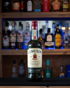 A Bottle of Jameson Original on a home bar top.