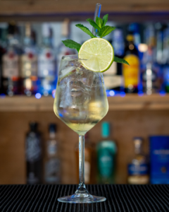 The Hugo Spritz cocktail on a home bar top