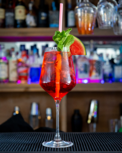 The Watermelon Spritz cocktail on a home bar top