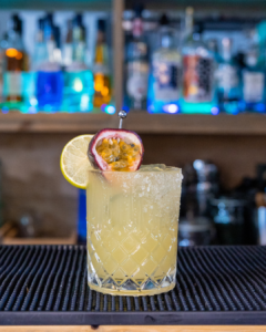 The Passionfruit Margarita cocktail on a homebar top.