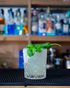 The Spicy Basil Margarita cocktail on a homebar top