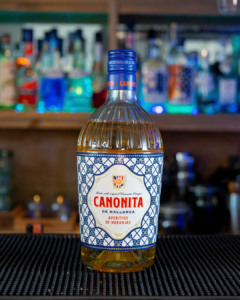 A bottle of Canonita on a home bar top