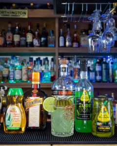 The Pickle Margarita cocktail on a home bar top